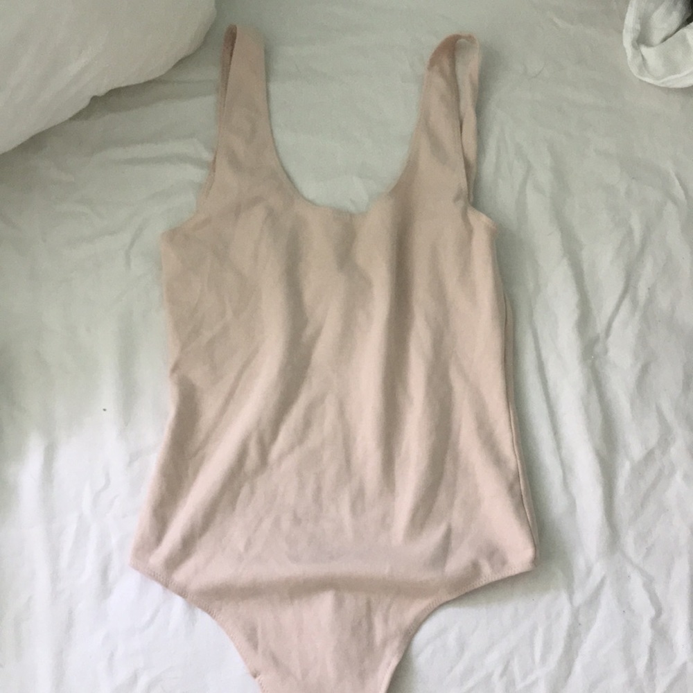 Cute light pink body suit
